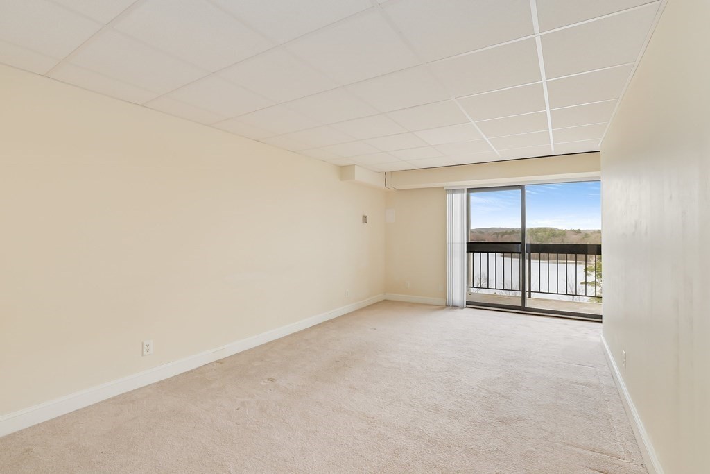 1500 Worcester Road, Unit 710 Framingham, MA 01702 - Photo 5 of 33 an empty room with windows