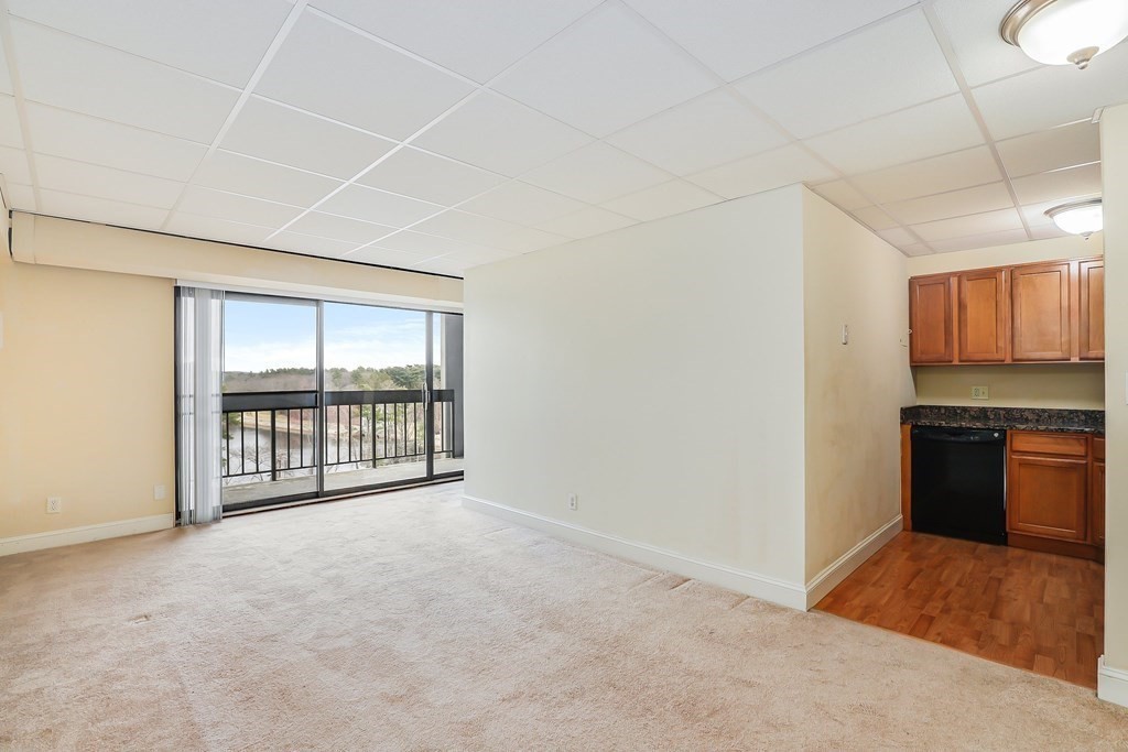 1500 Worcester Road, Unit 710 Framingham, MA 01702 - Photo 6 of 33 a view of an empty room with a window