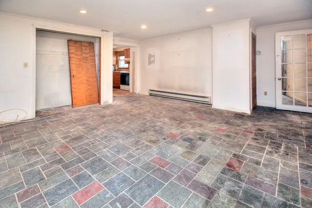 a white toilet sitting next to a bathroom sink
