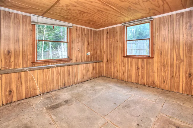 a view of an empty room with a window