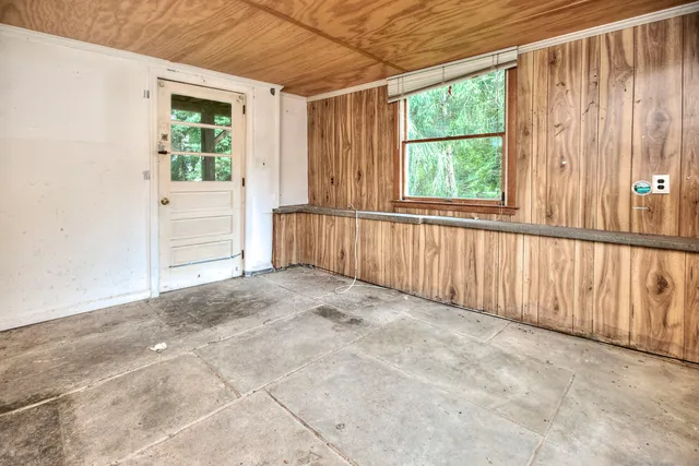 a view of a garage with wooden floor
