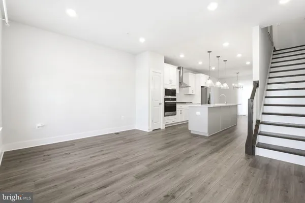 a view of kitchen with wooden floor