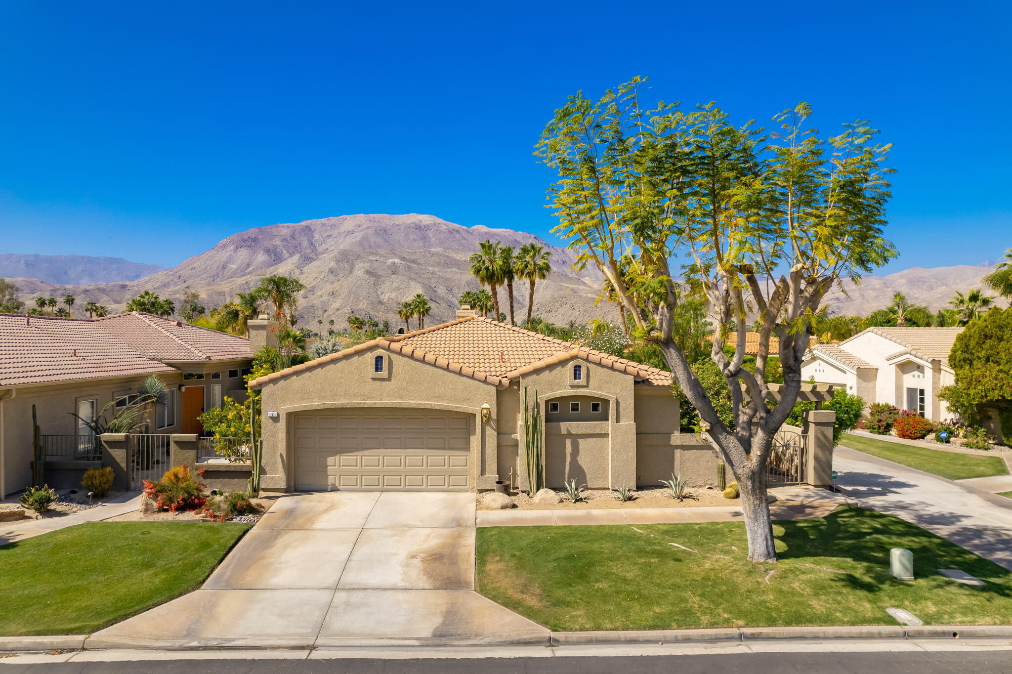 7 Florentina Drive Rancho Mirage, CA 92270 - Photo 1 of 7 a front view of a house with a yard