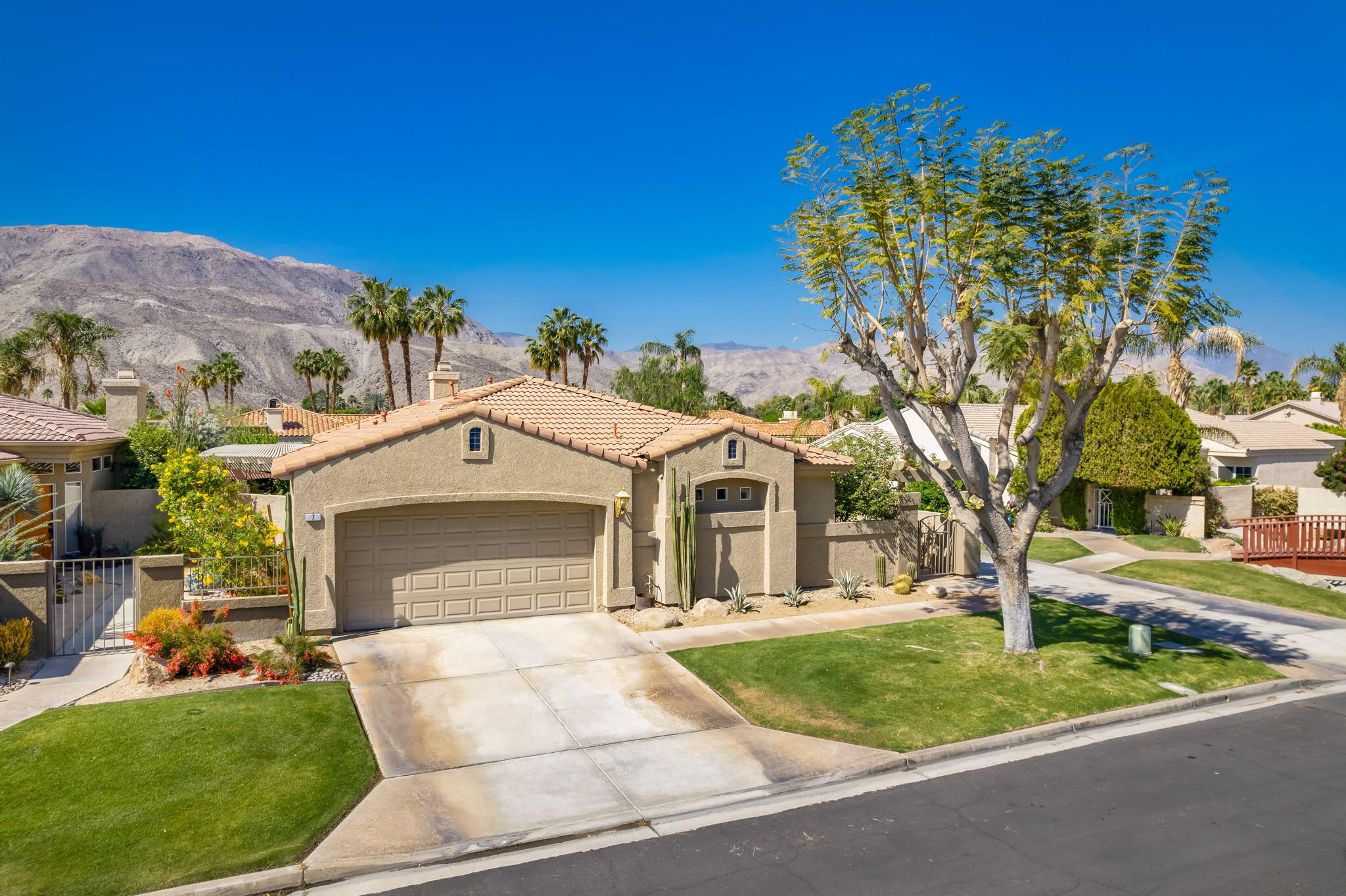 7 Florentina Drive Rancho Mirage, CA 92270 - Photo 3 of 7 a front view of a house with garden