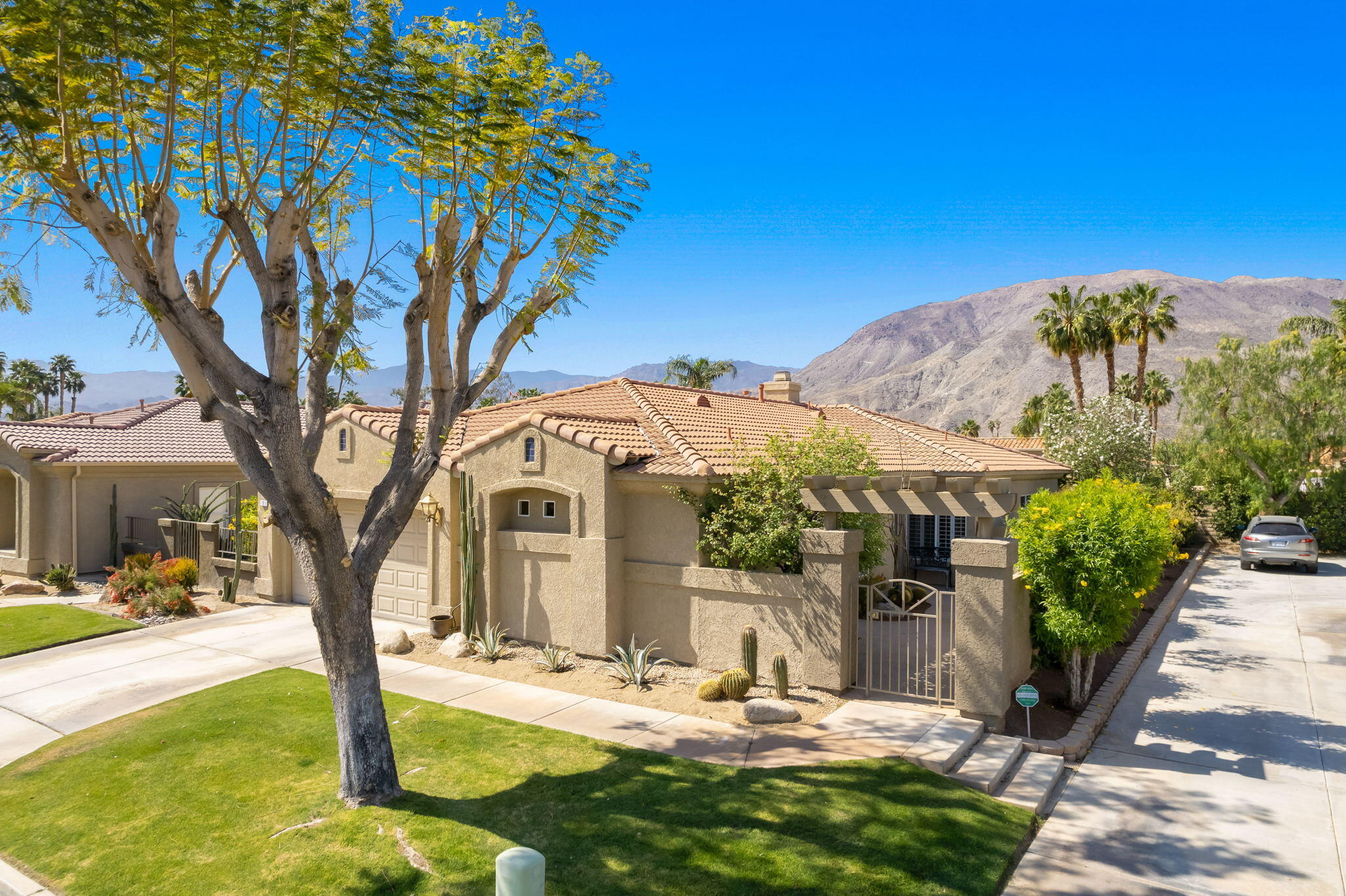 7 Florentina Drive Rancho Mirage, CA 92270 - Photo 5 of 7 a view of a house with backyard and sitting area