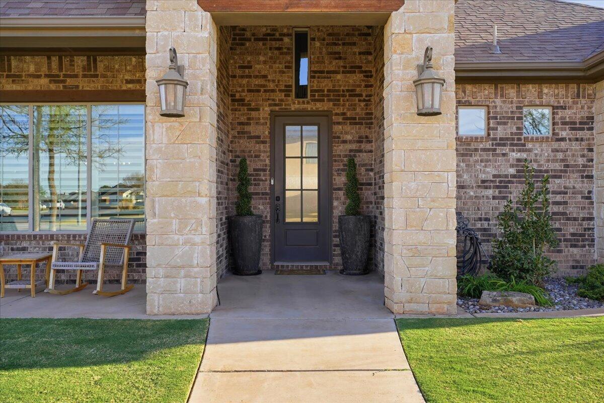 1202 North 14th Place Wolfforth, TX 79382 - Photo 12 of 75 a front view of a house with a yard