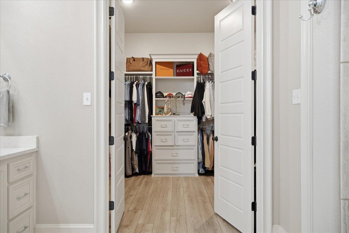 1202 North 14th Place Wolfforth, TX 79382 - Photo 39 of 75 a view of a hallway with wooden floor and closet