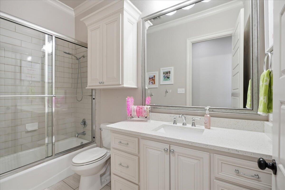 1202 North 14th Place Wolfforth, TX 79382 - Photo 48 of 75 a bathroom with a sink a toilet and shower