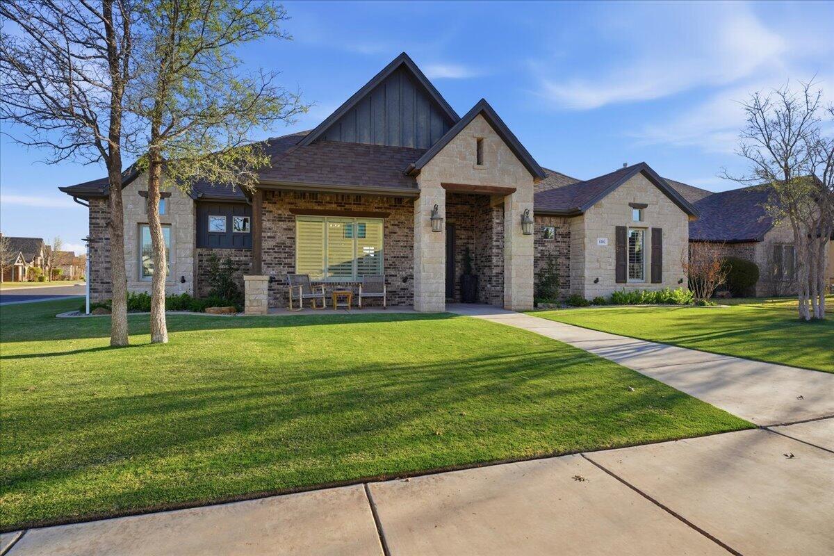1202 North 14th Place Wolfforth, TX 79382 - Photo 5 of 75 a front view of a house with a yard