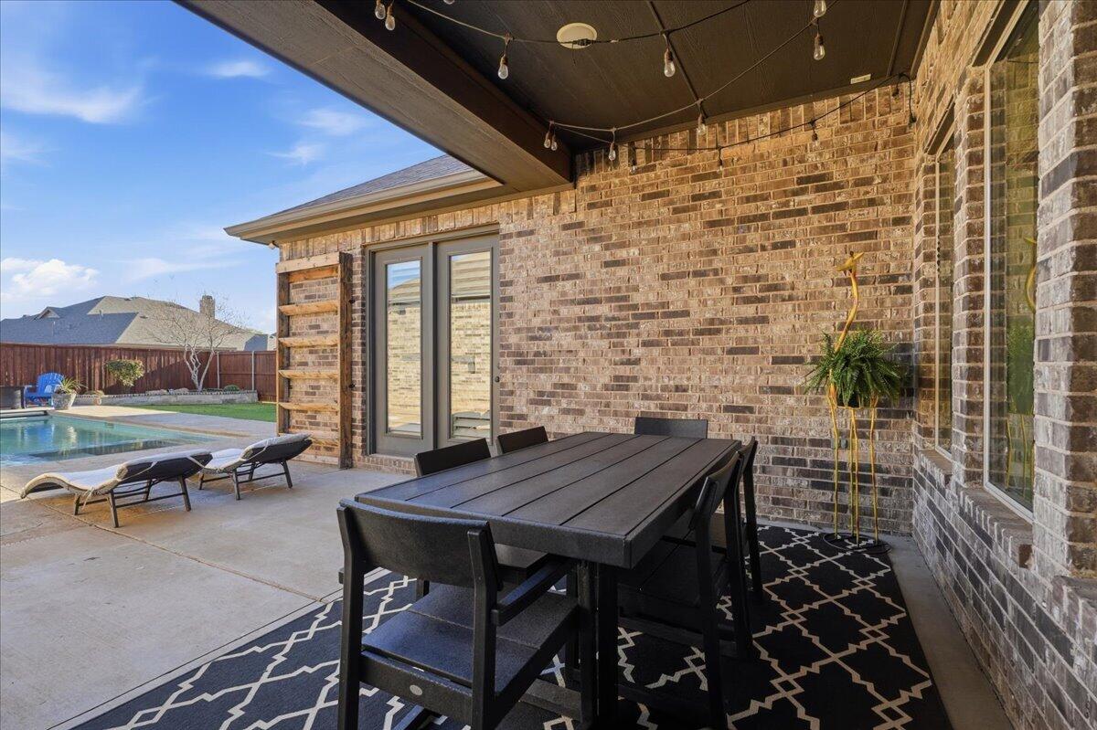 1202 North 14th Place Wolfforth, TX 79382 - Photo 56 of 75 a backyard of a house with outdoor seating