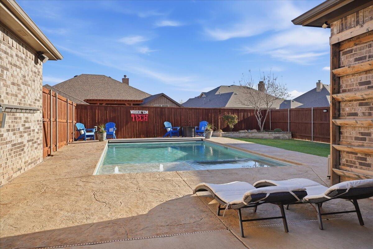 1202 North 14th Place Wolfforth, TX 79382 - Photo 61 of 75 a backyard of a house with table and chairs