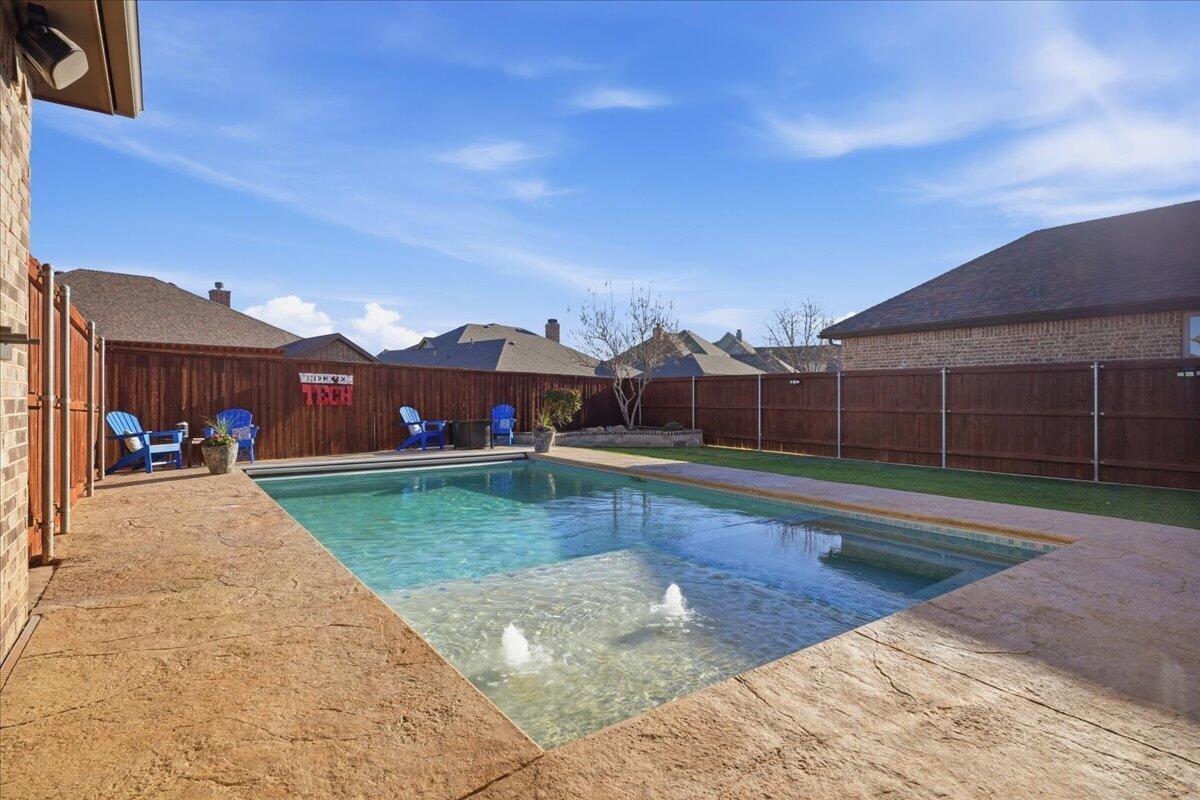 1202 North 14th Place Wolfforth, TX 79382 - Photo 63 of 75 a view of a house with a swimming pool