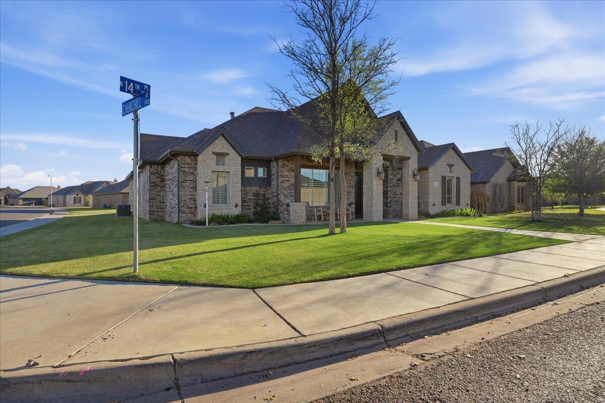 1202 North 14th Place Wolfforth, TX 79382 - Photo 7 of 75 a view of a house with a big yard plants and palm trees