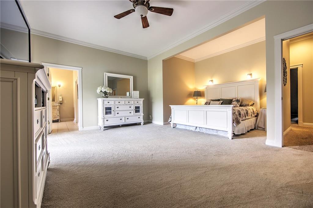 118 Klein Road Cranberry Township, PA 16066 - Photo 12 of 25 20x18 Master bedroom with crown molding, ceiling fan/light, sliders to back patio and full en-suite including a spacious walk-in closet.