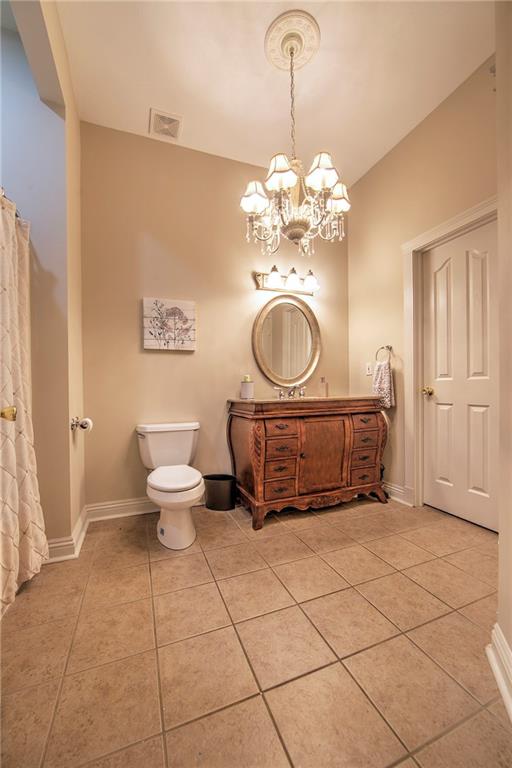 118 Klein Road Cranberry Township, PA 16066 - Photo 17 of 25 Full bath for Bedroom 2 and 3 includes tile flooring, custom vanity, chandelier lighting and walk-in closet.