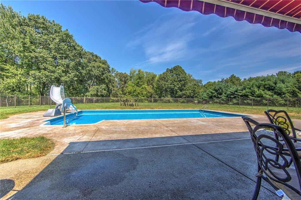 118 Klein Road Cranberry Township, PA 16066 - Photo 24 of 25 20x40 heated (heat pump) saltwater pool with slide. Aluminum fencing with three gate access. Conduit raceway included for future electric run to the backyard.