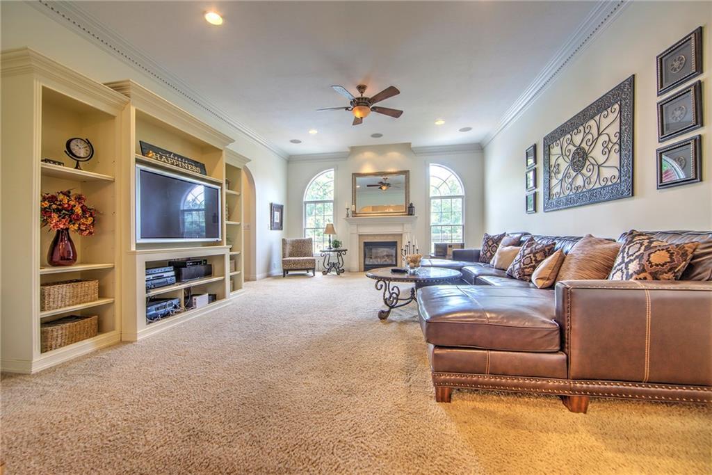 118 Klein Road Cranberry Township, PA 16066 - Photo 6 of 25 Gorgeous windows frame the propane fireplace in this spacious, 20x16 family room which features dental crown molding, surround sound speakers with a Triad subwoofer amplifier, and custom built entertainment center.