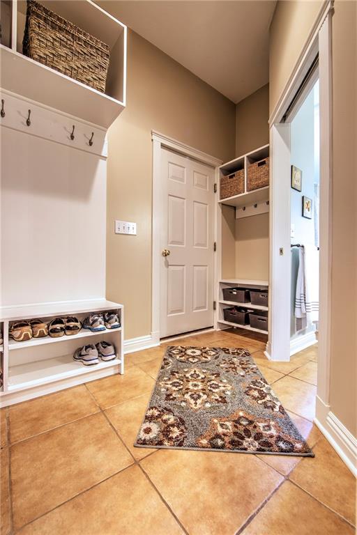 118 Klein Road Cranberry Township, PA 16066 - Photo 10 of 25 Mud room offers custom, locker-style built-ins, additional pantry, full bath with granite counter and access to the garage and patio/pool area.