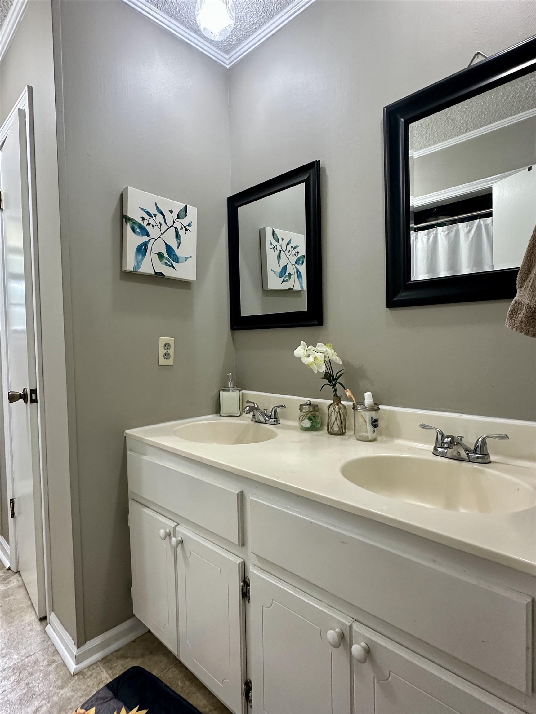 320 Clayton Road Finger, TN 38334 - Photo 12 of 16 Bathroom with crown molding, double vanity, and a shower with curtain
