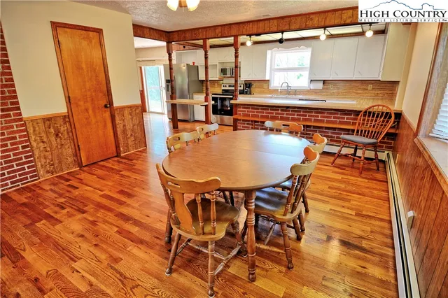 a dining room with a table and chairs