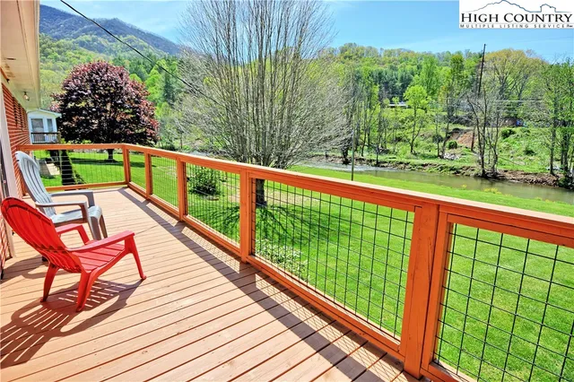 a view of a two chairs in the balcony