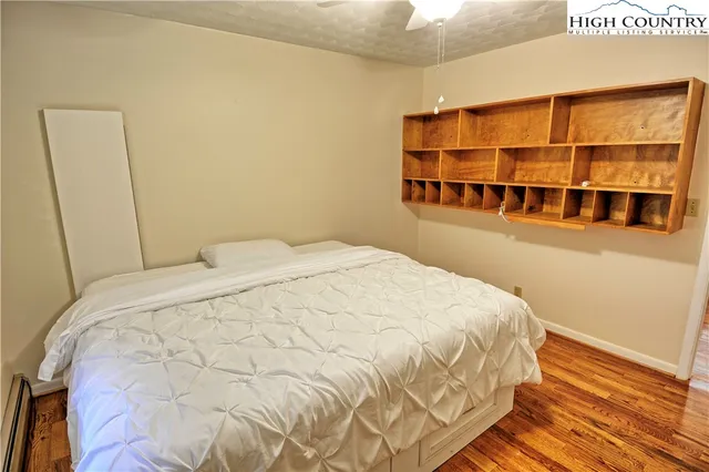 a large bed sitting in a bedroom next to a small yard