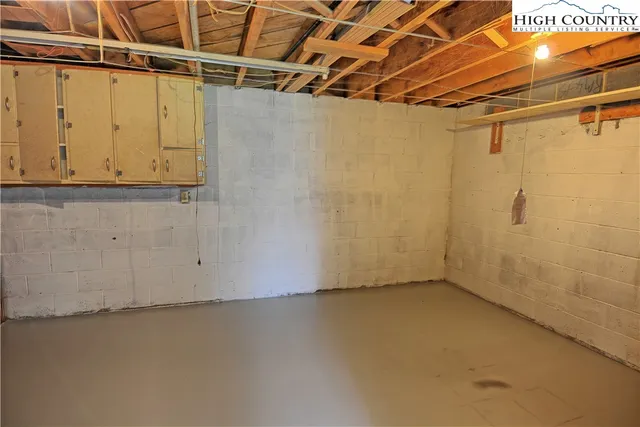 a view of a room with wooden walls