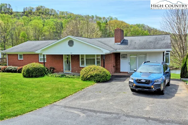 a car parked in front of a house