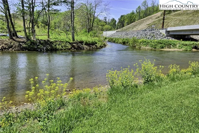 a view of a lake with a building in the background