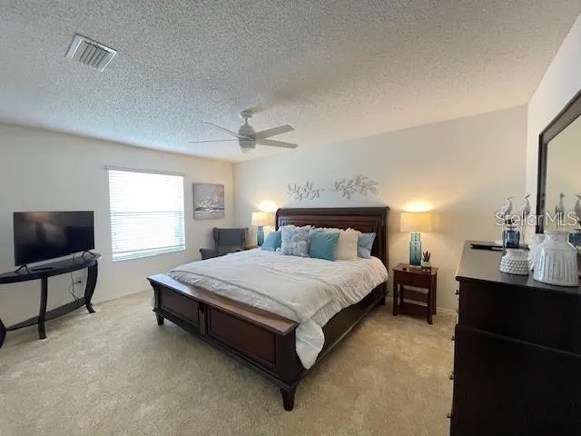 a bedroom with a bed and furniture