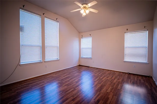 a bathroom with a tub sink and a mirror