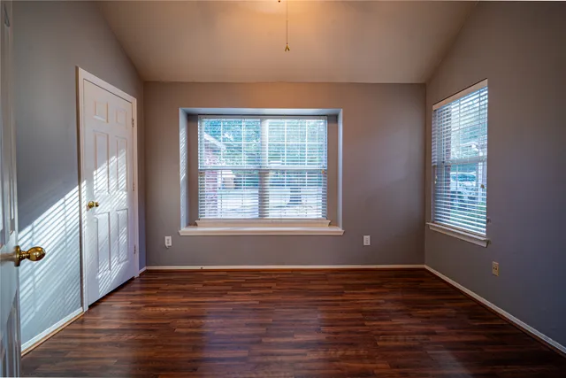 a bathroom with a sink mirror vanity and toilet