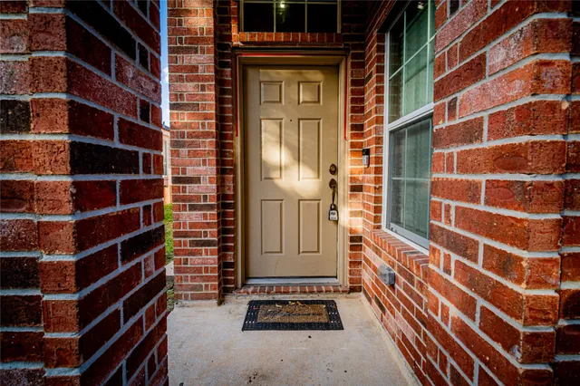 a view of a door and a window