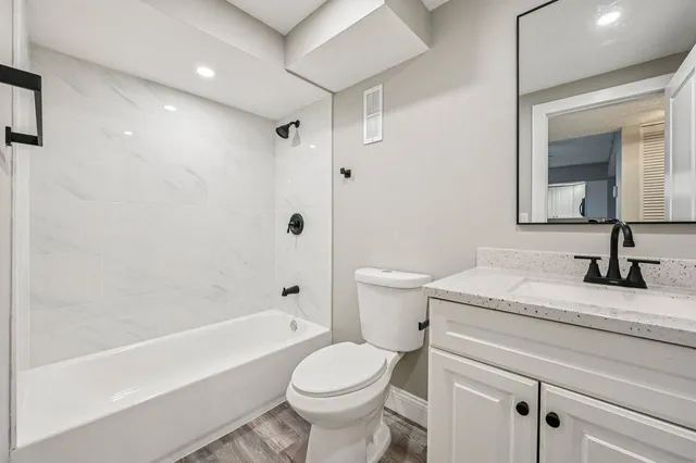 a bathroom with a sink a toilet and a bathtub