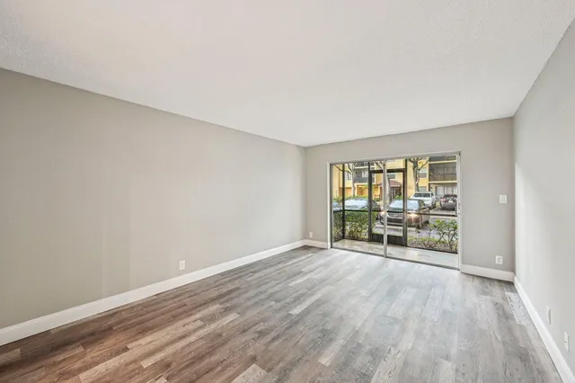wooden floor in a room with a window