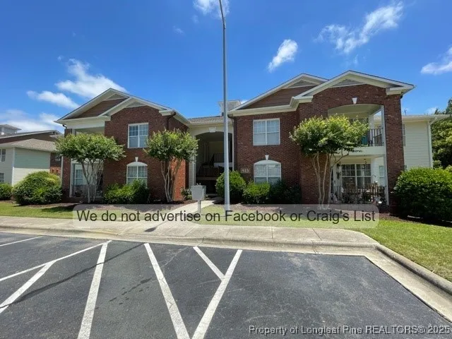 a view of a house with a yard and plants
