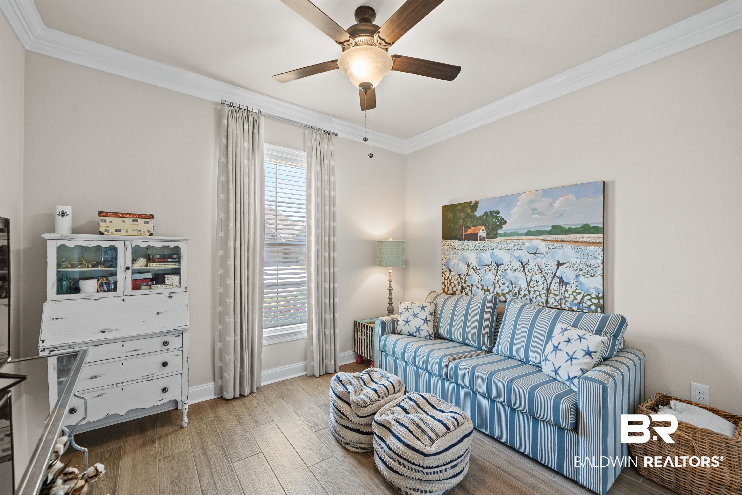 1509 Fenton Circle Foley, AL 36535 - Photo 18 of 34 Living area featuring baseboards, wood finished floors, ceiling fan, and ornamental molding