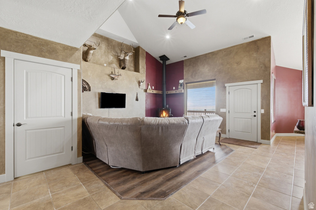 2567 West Rim Rock Drive Stockton, UT 84071 - Photo 19 of 64 Great room featuring a vaulted ceiling with recessed lighting, a ceiling fan, and wood-finish flooring