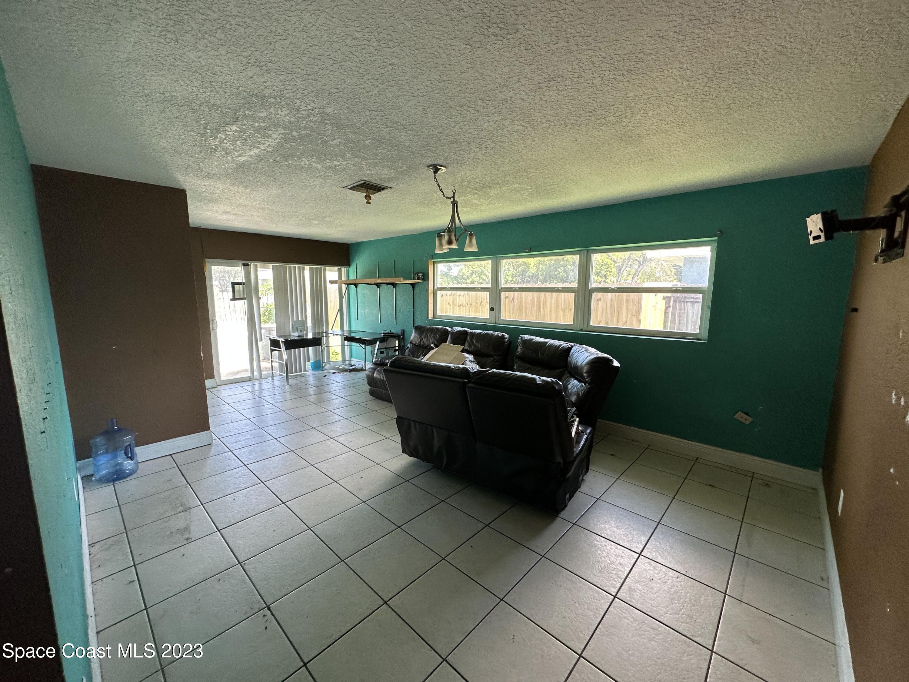 2741 Rhapsody Street Palm Bay, FL 32905 - Photo 4 of 15 IMG_1710