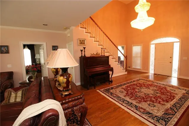 a living room with furniture and a rug