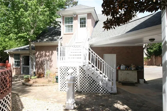 a view of a house with wooden fence