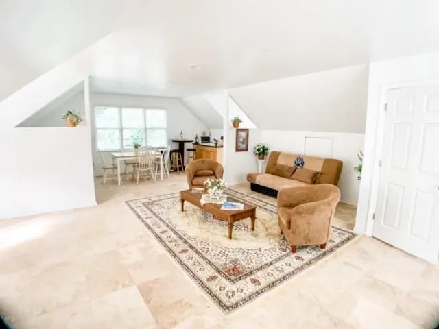 a living room with furniture and a table