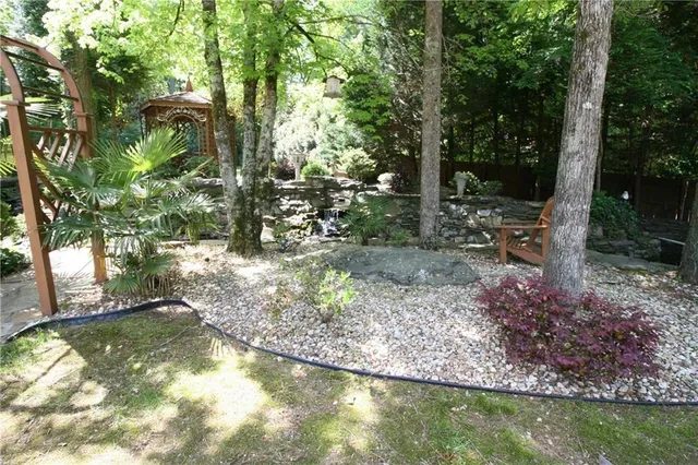 a view of swimming pool with a yard