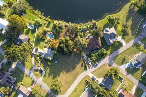 a view of swimming pool with a yard and outdoor seating