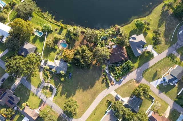 a view of swimming pool with a yard and outdoor seating