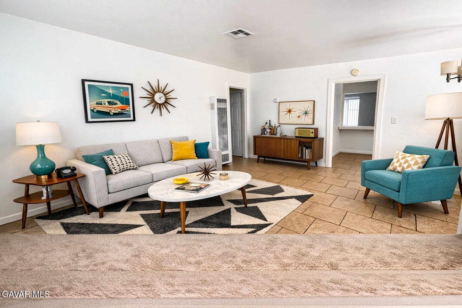 44226 2nd Street East Lancaster, CA 93535 - Photo 6 of 24 a living room with furniture a rug and a table
