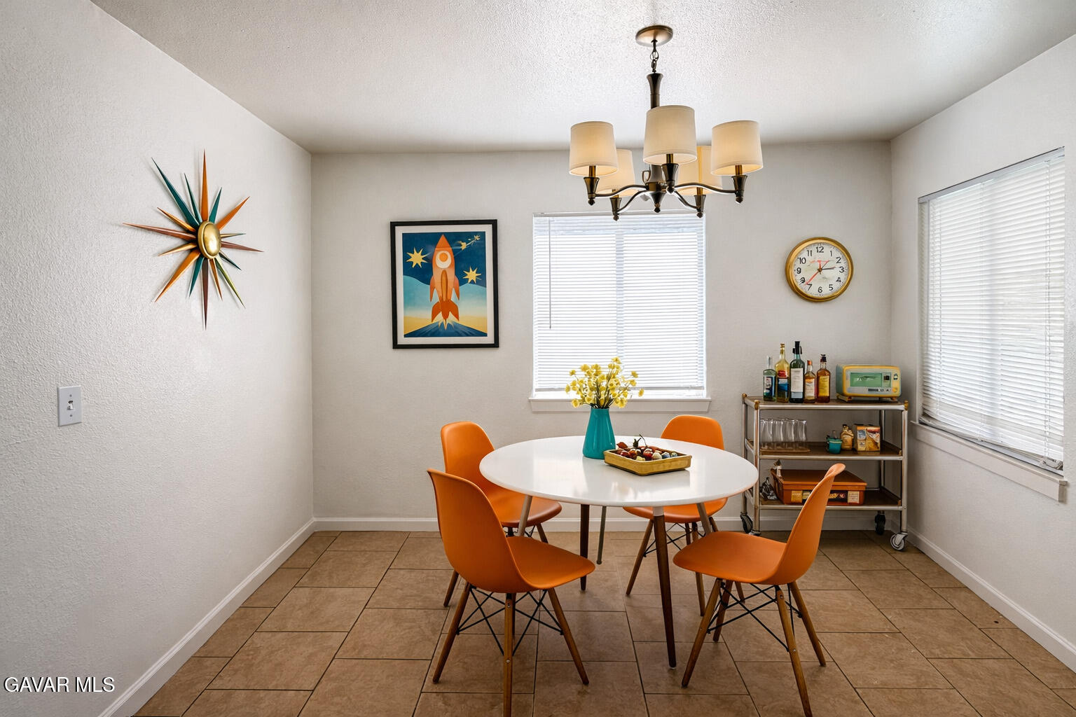 44226 2nd Street East Lancaster, CA 93535 - Photo 10 of 24 a view of a dining room with furniture and a chandelier