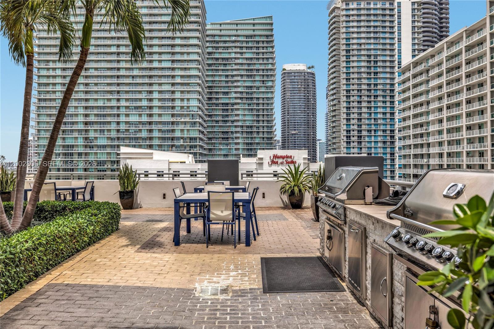 60 Southwest 13th Street, Unit 1124 Miami, FL 33130 - Photo 25 of 30 a view of a patio with chairs and table