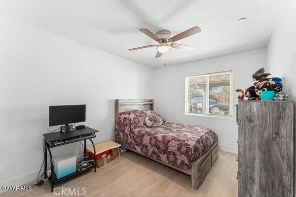 a bedroom with a bed window and bed