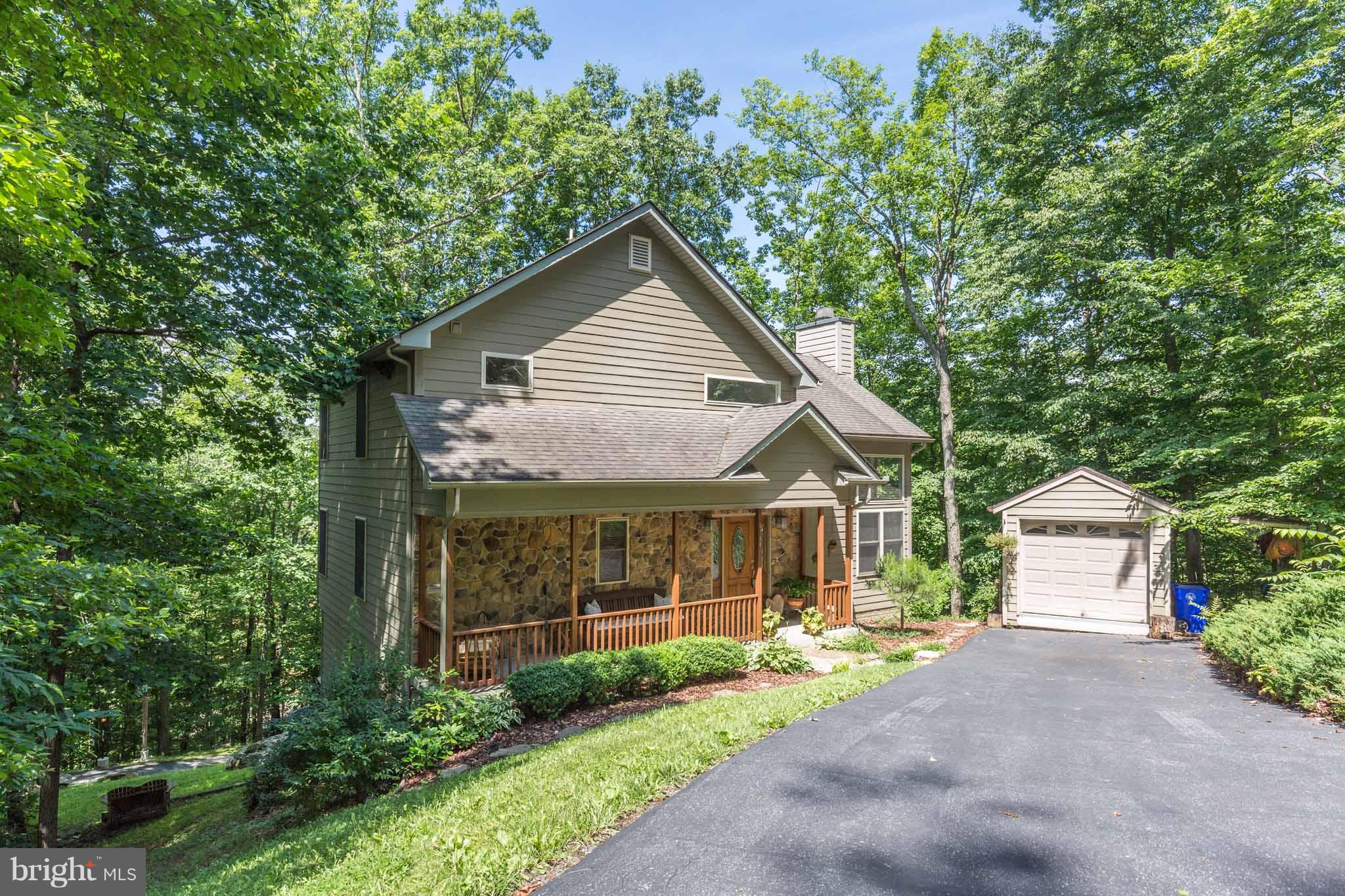 6704 West Lakeridge Road New Market, MD 21774 - Photo 1 of 30 a front view of a house with garden